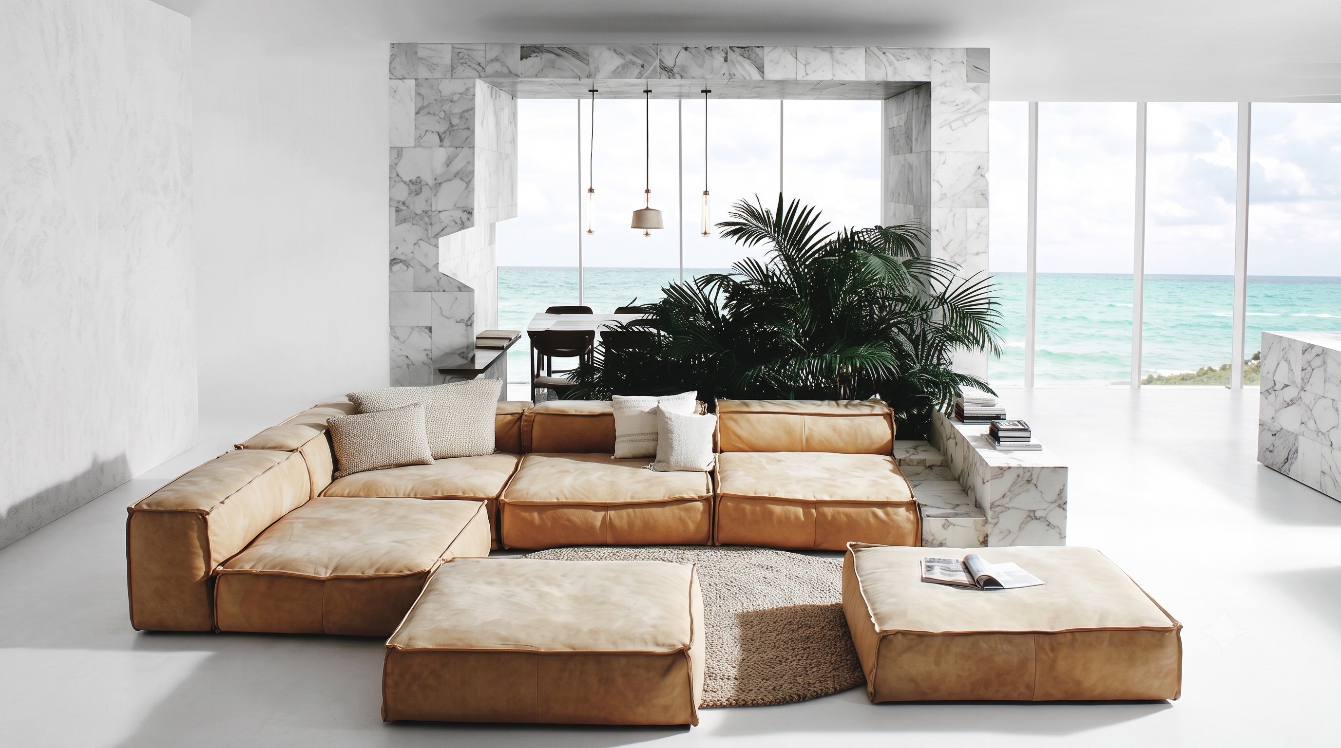 A sun-drenched inner courtyard: pale sofa, olive tree and carved arches